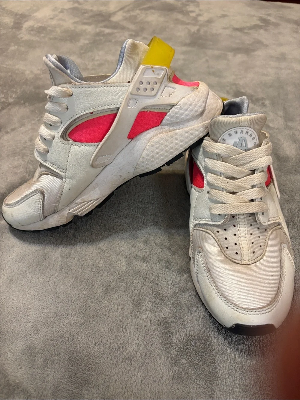 Nike White Athletic Sneakers with Pink Panels and Yellow Heel Tab